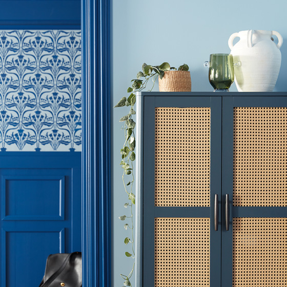 Light wooden shelf holds accessories chosen to express personal style.