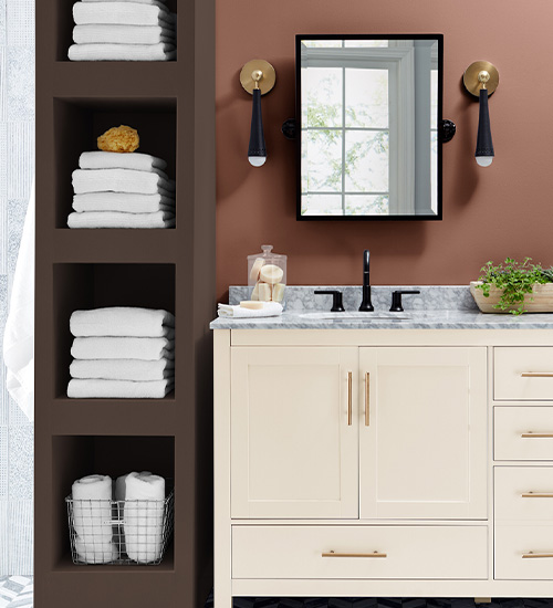 Modern bathroom with mirror and sconces, a Canyon Earth wall, tall Deep Earth shelving and a Cream in My Coffee vanity.